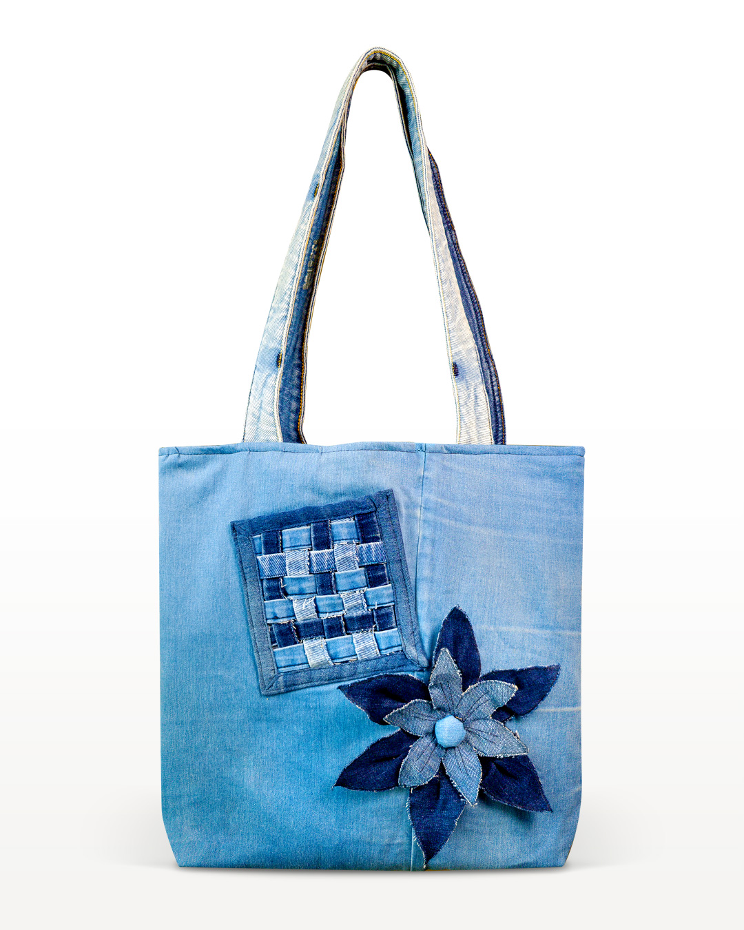 Orange Seed recycled denim tote bag with handmade floral detail